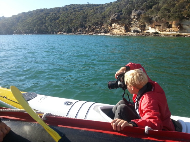 photographer in mirage kayak